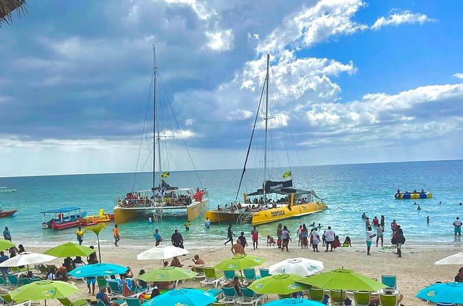 7 Mile Beach Party Catamaran Cruise with Snorkeling & Ricks Cafe - Two hours on 7 Mile Beach