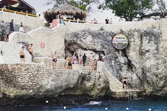 Bamboo Rafting and Limestone Foot Massage with Ricks Cafe Private Tour - Rick’s Cafe for cliff jumps, reggae, and sunset