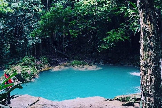 Blue Hole and Martha Brae Full-Day Tour from Montego Bay - Martha Brae trades jumps for a quiet river ride