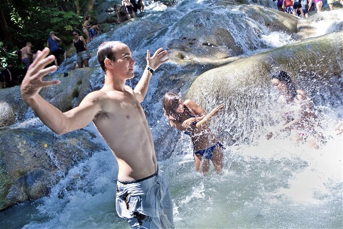 Dunn's River Falls and Ocho Rios Shopping Tour from Montego Bay Hotels - Climbing the falls with a local guide