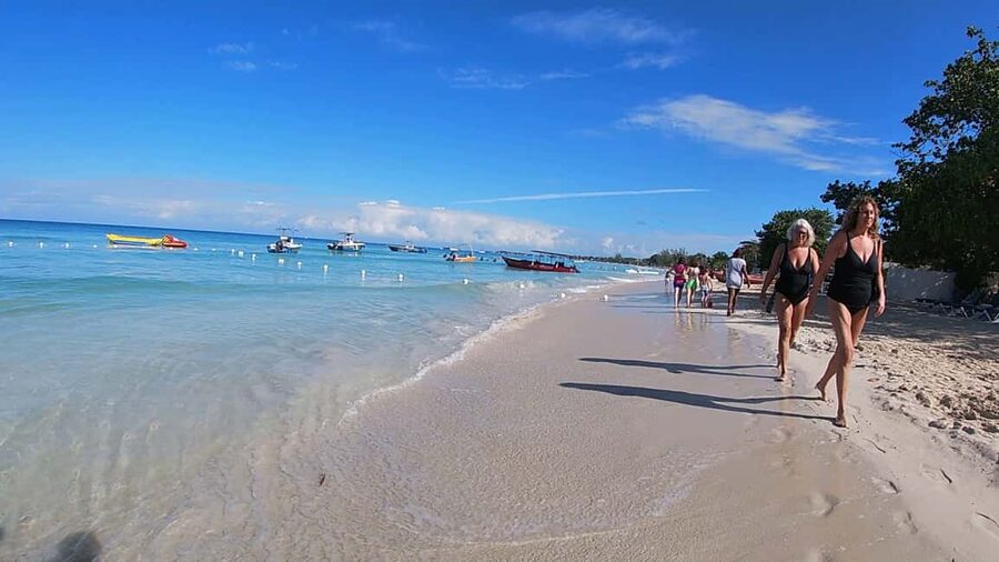 From Montego Bay: Negril Beach & Rick's Cafe Sunset Day Trip - Seven Mile Beach and the Margaritaville stop