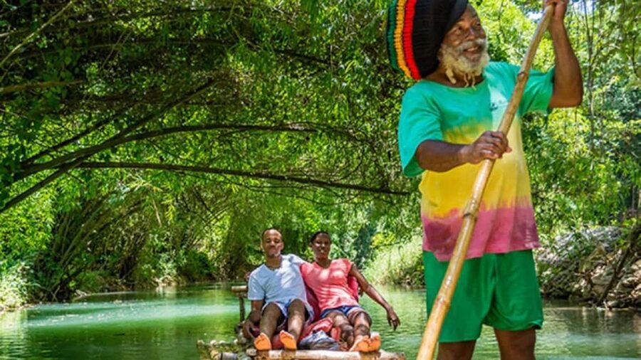 Jamaica: Bamboo Rafting on the Martha Brae - Settling onto a bamboo raft at Rafter’s Village