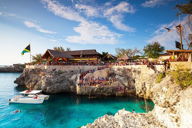 Private Trip to Blue Hole Mineral Springs, Negril & Ricks Café - Rick’s Cafe at sunset
