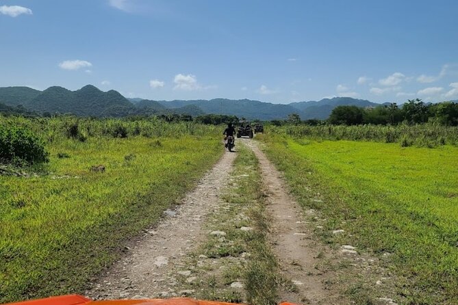 Rastasafari Experience ATV Adventure and Local Day Out - Riding an ATV through the countryside